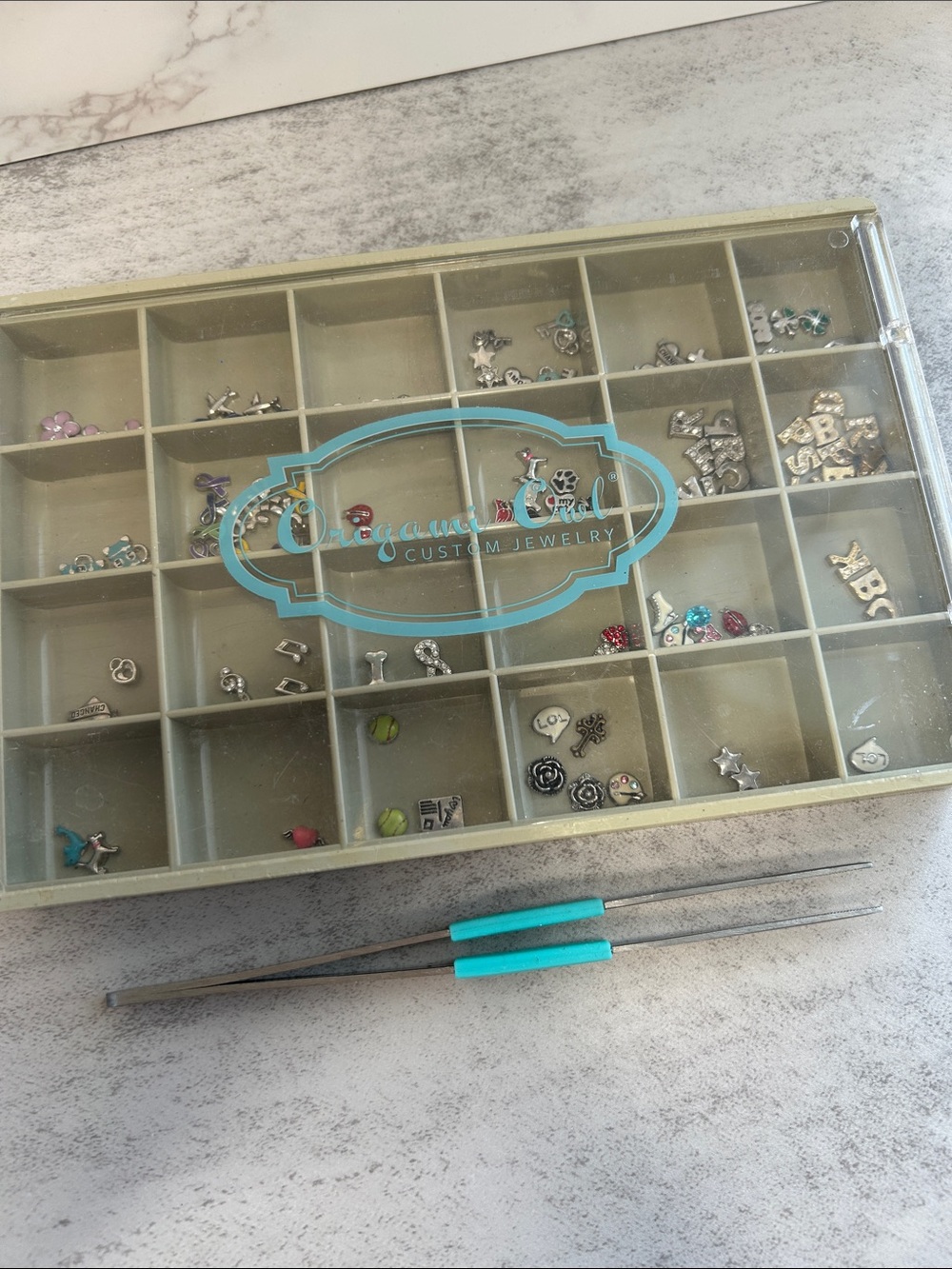 Bundle of tons of Origami Owl Charms in organizer with tool